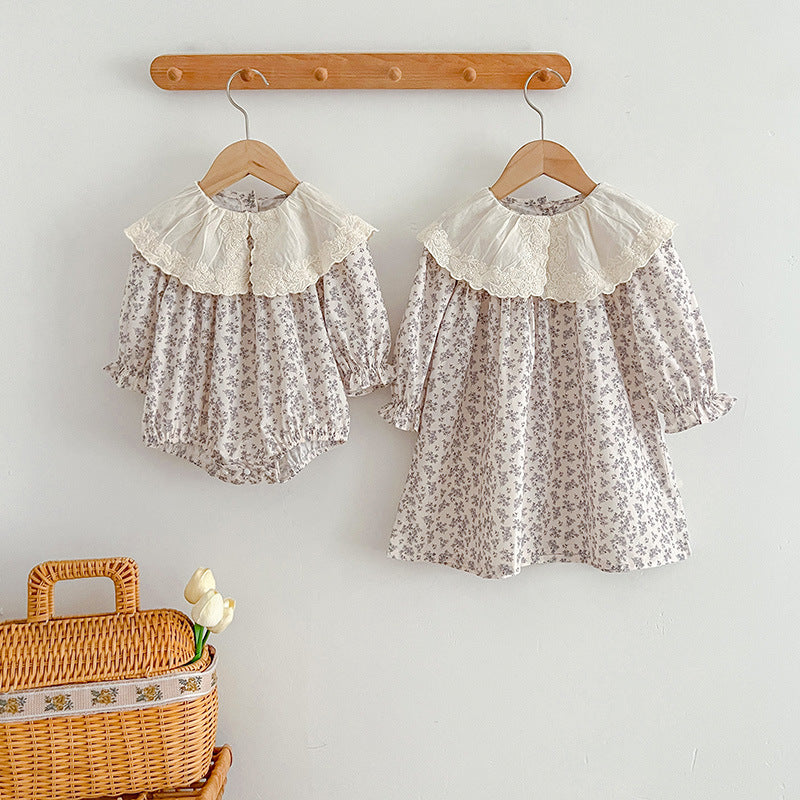 Floral matching sister dress set with light blue baby bodysuit and embroidered girl dress.