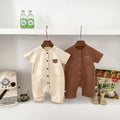 Short sleeve unisex baby teddy bear romper in soft cotton with a single breasted front closure