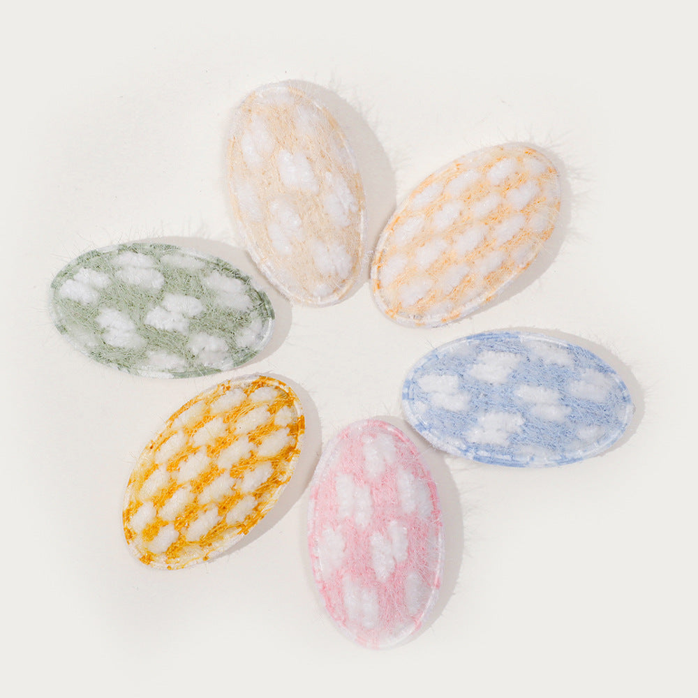 Baby fabric hair clip with cute dotted corn kernel print in soft pastel colors.