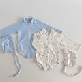 Kids long-sleeve rash guard swimsuit and matching swim cap in blue plaid and polka dots
