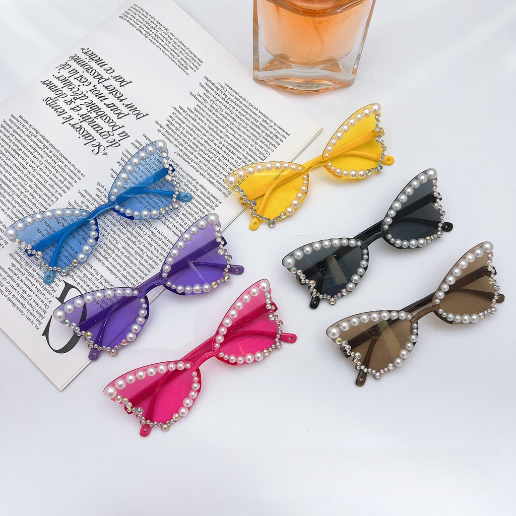 Trendy pearl butterfly sunglasses for girls featuring UV protection lenses and a lightweight elegant frame