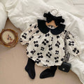 Baby girl floral princess bodysuit in apricot cotton with a doll neckline and long sleeves