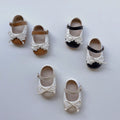 Toddler girl soft sole walking shoes in white with shoelace bow and anti-slip grip