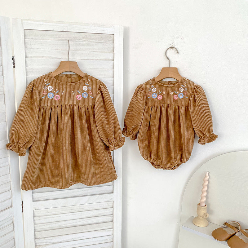 Embroidered baby dress set in brown featuring long sleeves and delicate floral patterns for girls.