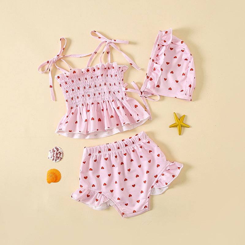 Girls heart pattern swimwear set in bright pink featuring a comfortable quick-drying two-piece toddler swimsuit