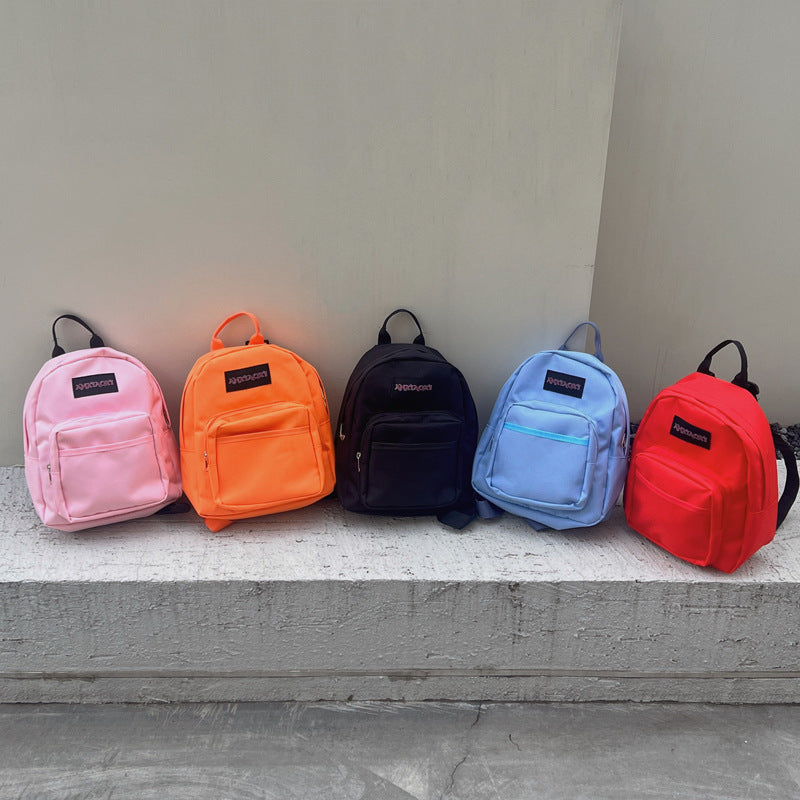 Lightweight children's canvas backpack with letter pattern available in multiple vibrant colors