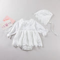 White baby girl bodysuit dress with floral embroidery, doll neck collar, and long sleeves in cotton