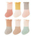 Unisex baby patchwork ruffle crew socks in bright colors, made of a soft cotton blend.