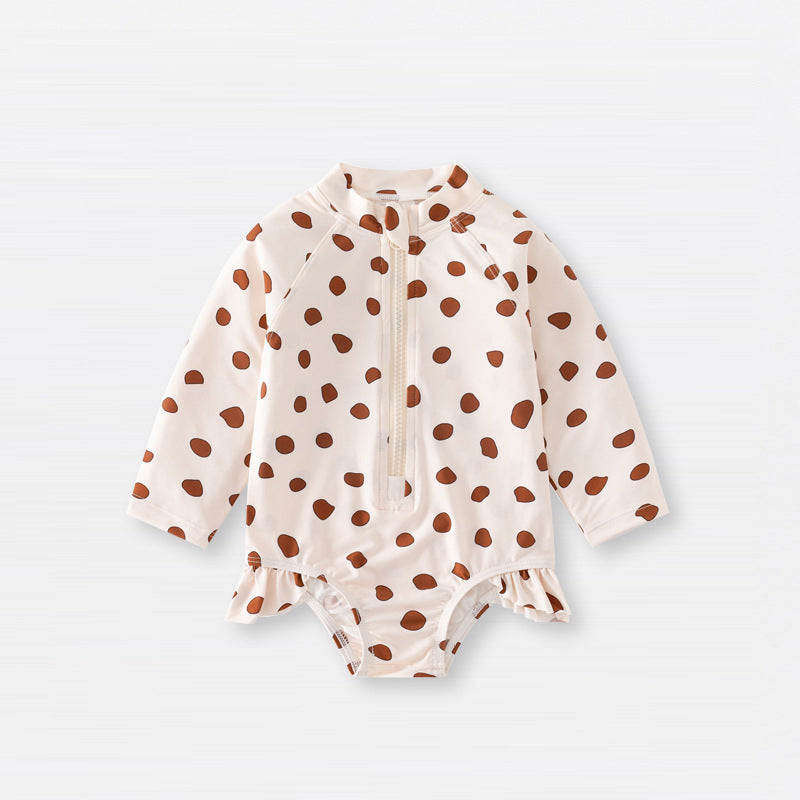 Baby girls zip-up swimwear in earthy floral and polka dot patterns with front zipper detail — view 2