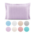 Quilted cotton pillow sham with piped edges and zipper closure for standard bed pillows.