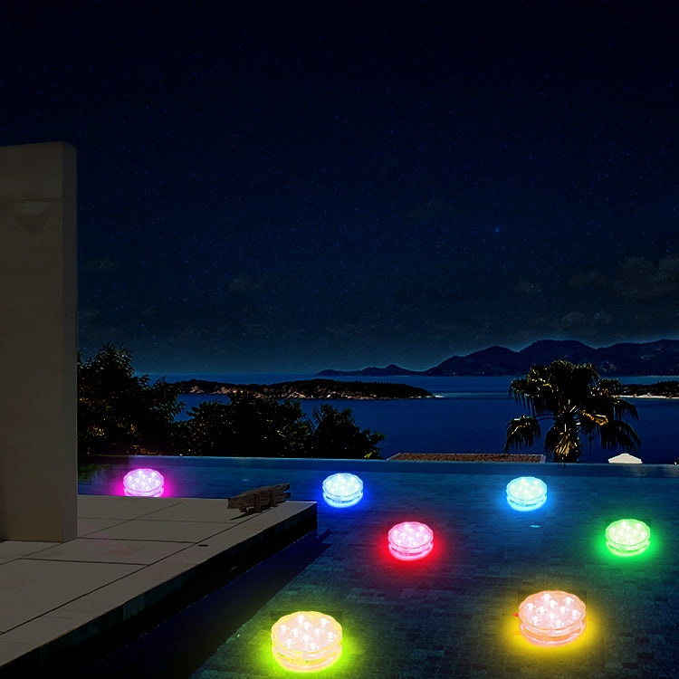 Waterproof submersible LED pool light showing 16 RGB colors with remote control in water setting — view 4