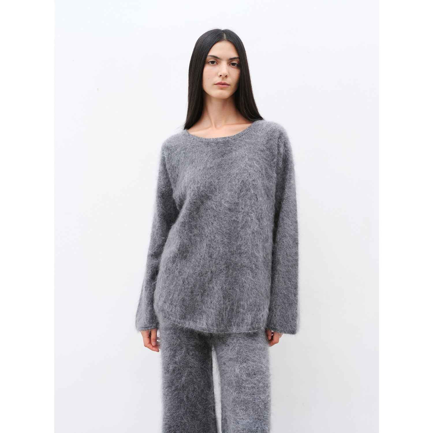 Women's purple two-piece cashmere lounge set featuring a loose crewneck sweater and wide-leg pants — view 4