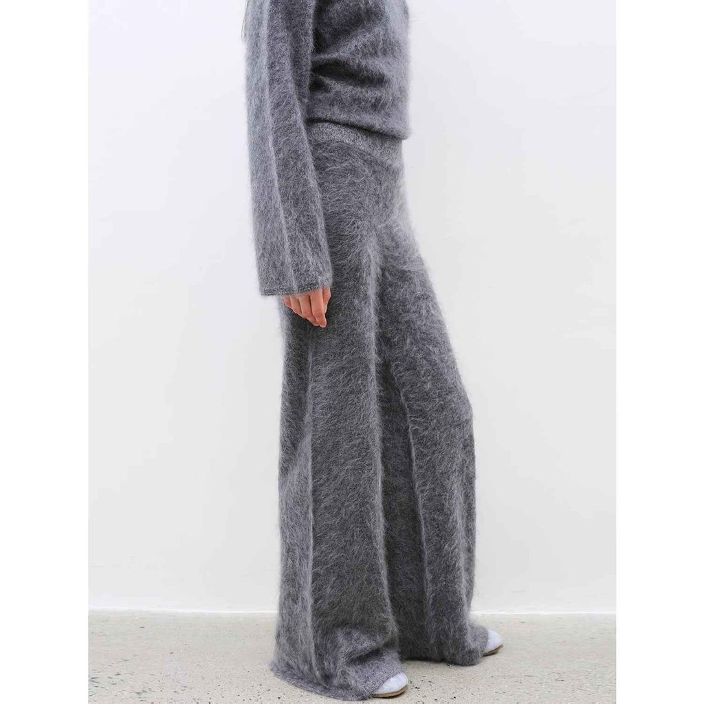 Women's purple two-piece cashmere lounge set featuring a loose crewneck sweater and wide-leg pants — view 5