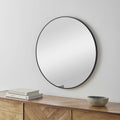 Contemporary round wall mirror with a sleek black aluminum frame, perfect for modern home interiors.