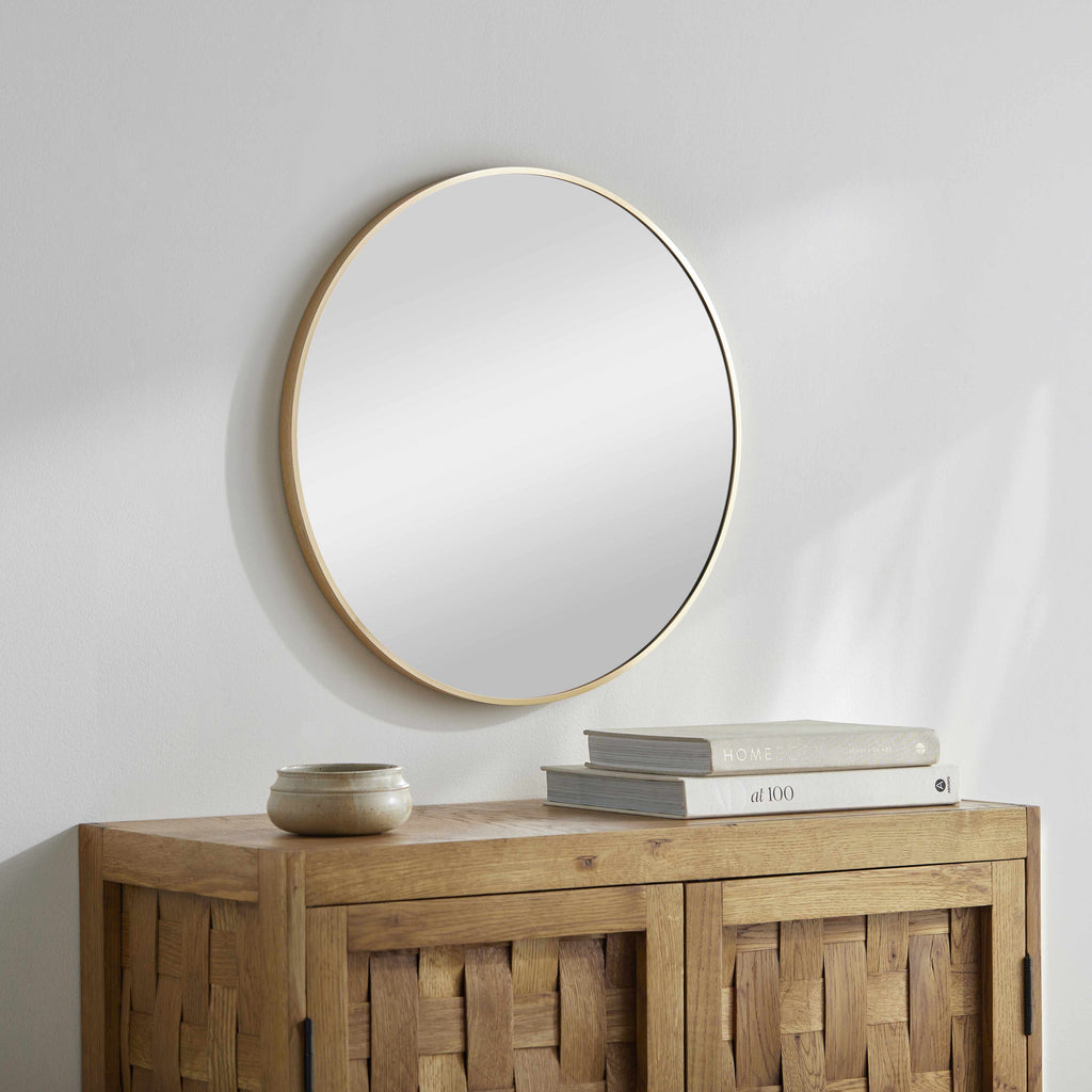 Pontalina round gold wall mirror with a contemporary aluminum frame for elegant modern home decor