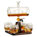 Hand-blown glass ship whiskey decanter with 1000ml capacity on a mahogany wood display base