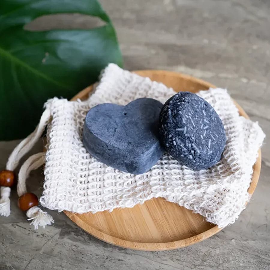 Plant-based rebalancing shampoo and conditioner bar set infused with charcoal and essential oils — view 5