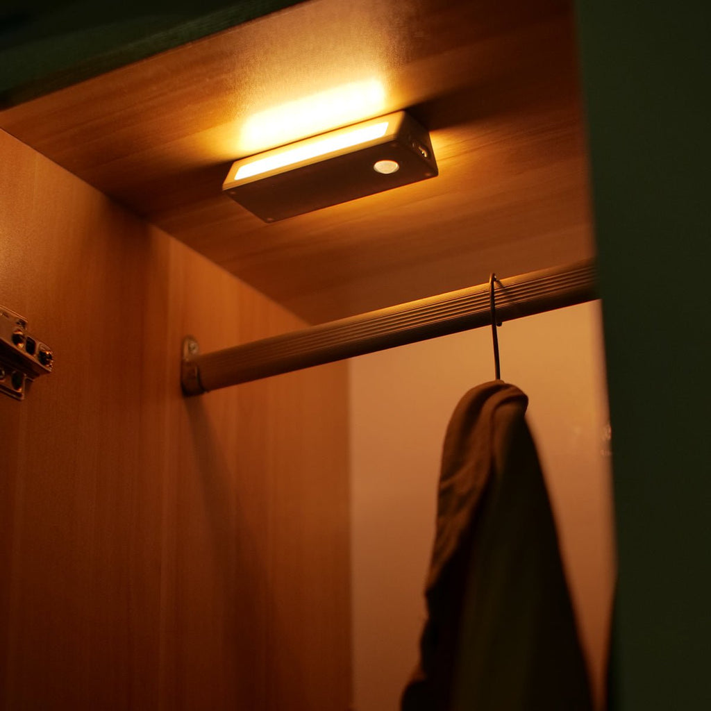 Rechargeable wooden wall night light with magnetic mount emitting a warm LED glow indoors — view 5