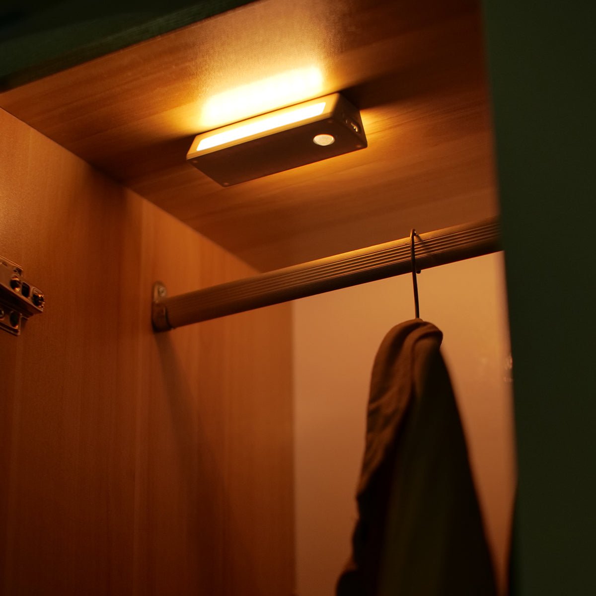 Rechargeable wooden wall night light with magnetic mount emitting a warm LED glow indoors — view 5