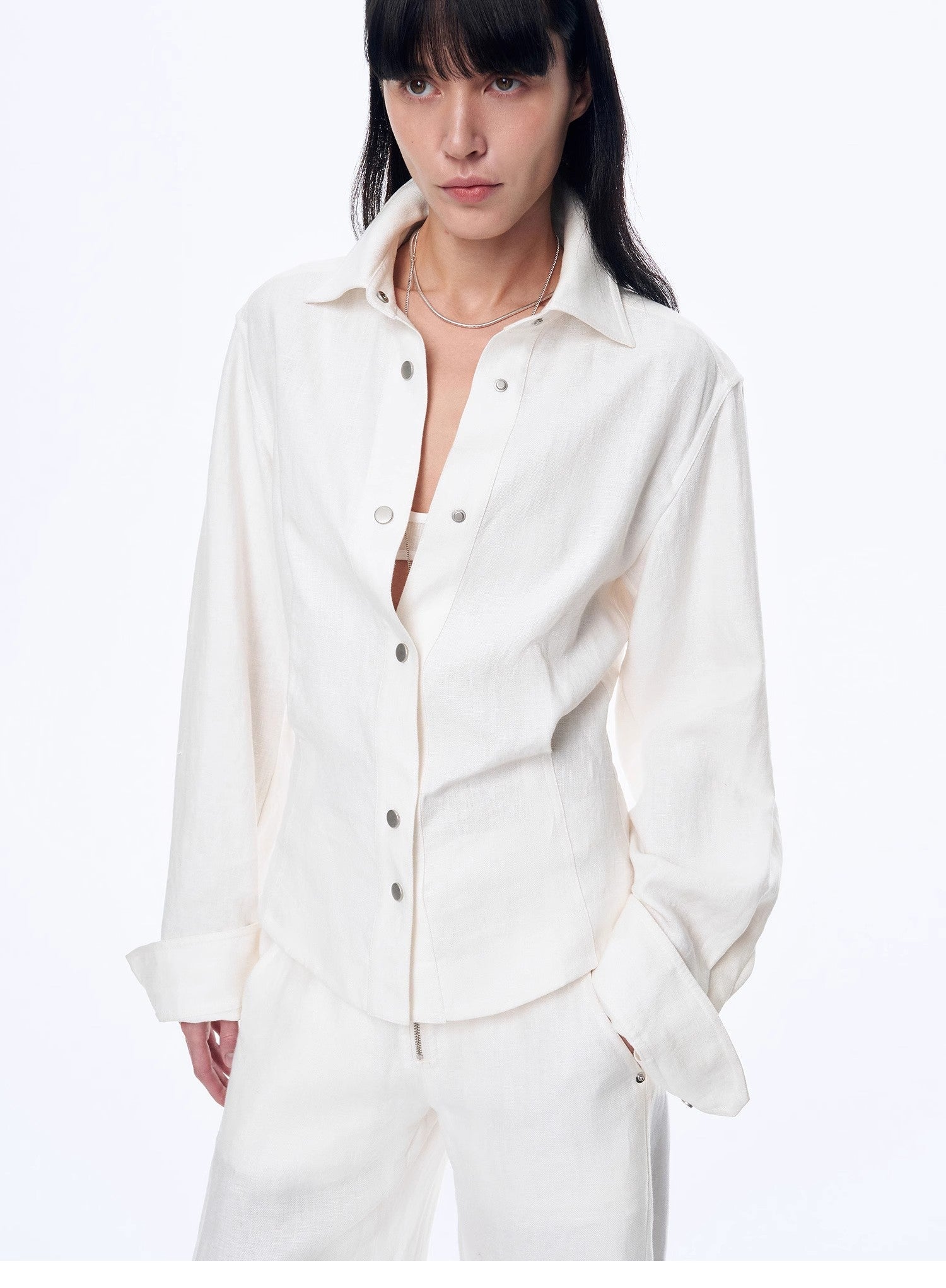 Women's deconstructed blue linen twill blouse with waist pleats in an old money style — view 3