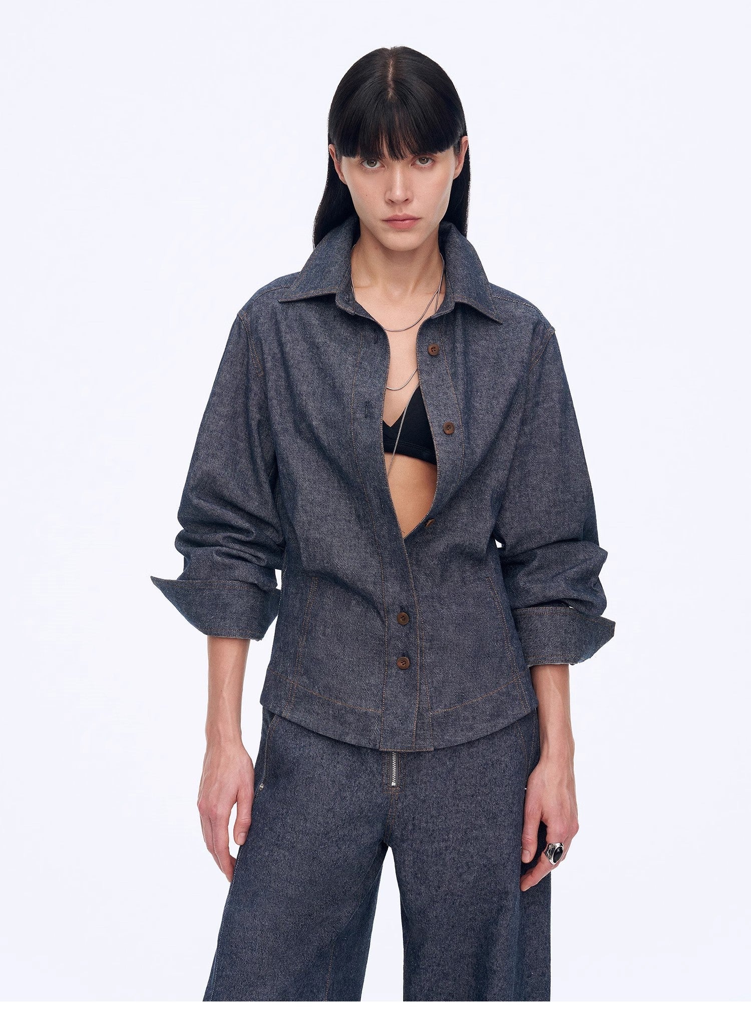 Women's deconstructed blue linen twill blouse with waist pleats in an old money style