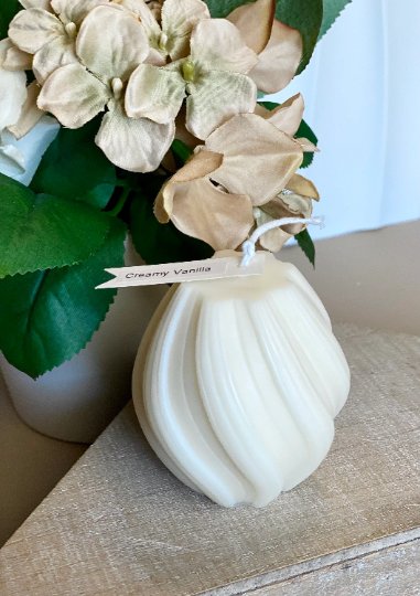 Ribbed twirl candle in sculptural twisted design, made of white handcrafted eco-friendly soy wax — view 5
