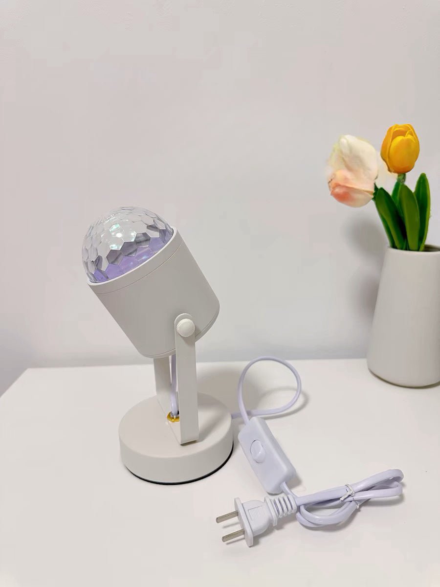 Modern aluminum ripple projector table lamp casting dynamic ambient water ripples on a dark room wall — view 5