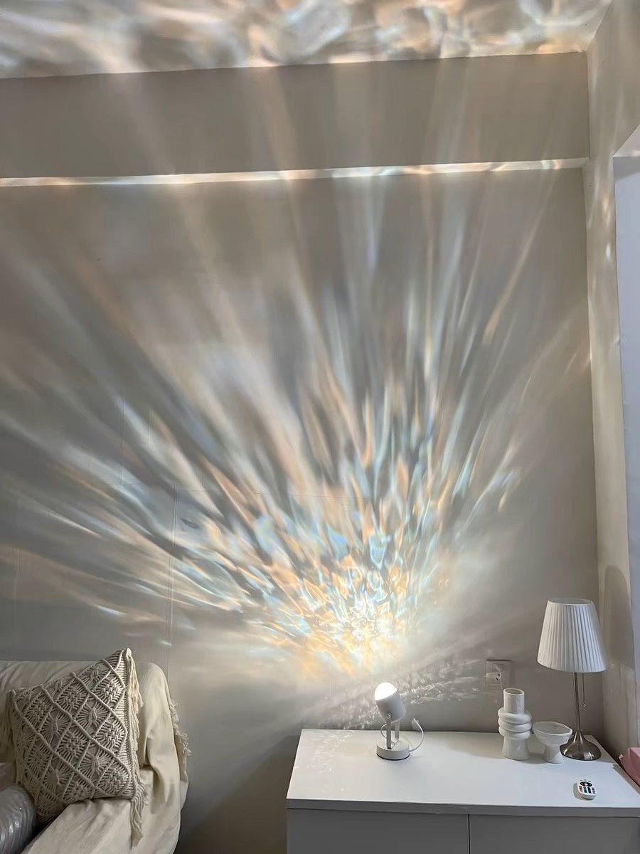Modern aluminum ripple projector table lamp casting dynamic ambient water ripples on a dark room wall — view 4
