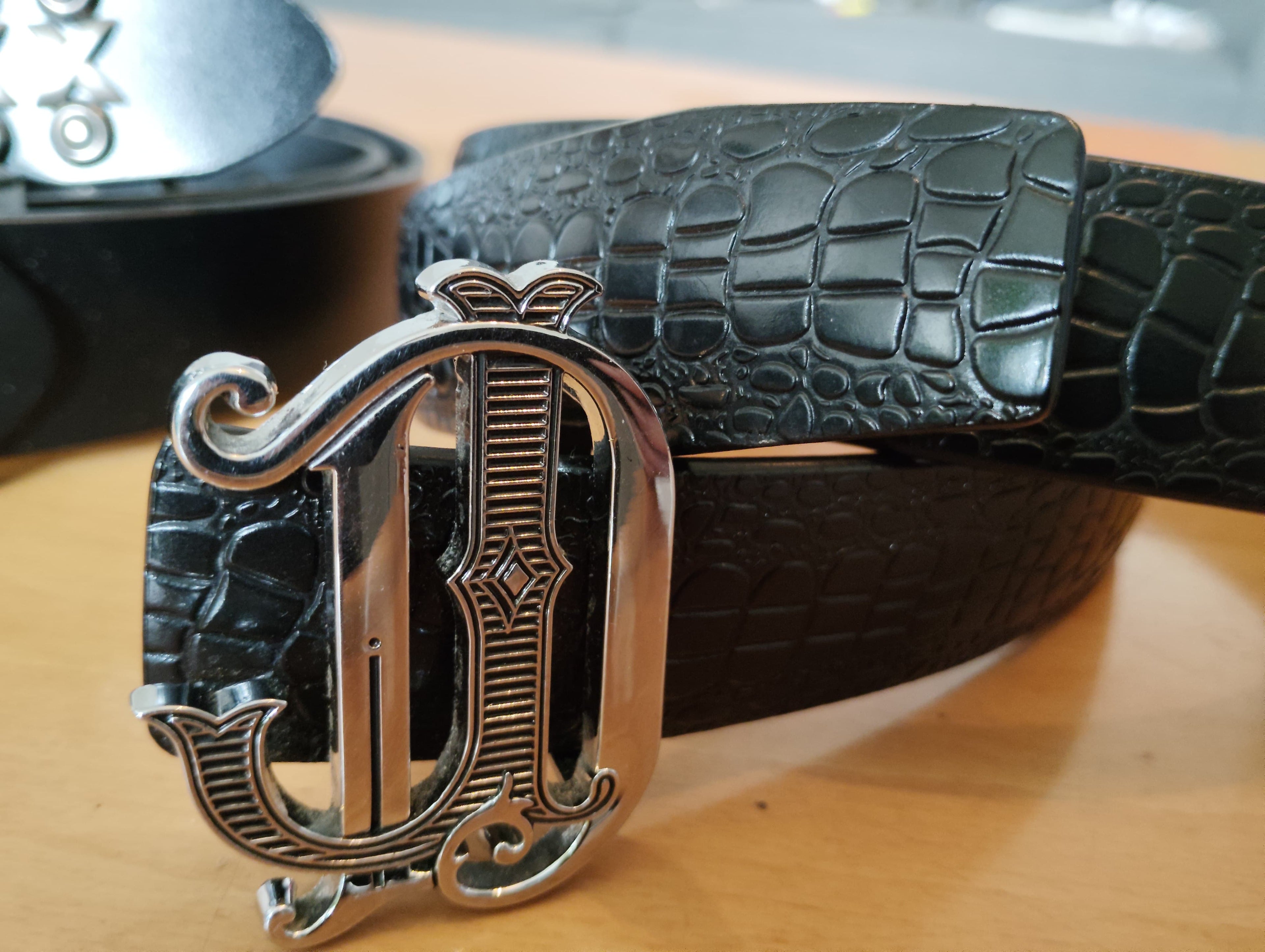 DON JOHN leather belt featuring a sleek metallic buckle and premium durable black strap — view 4