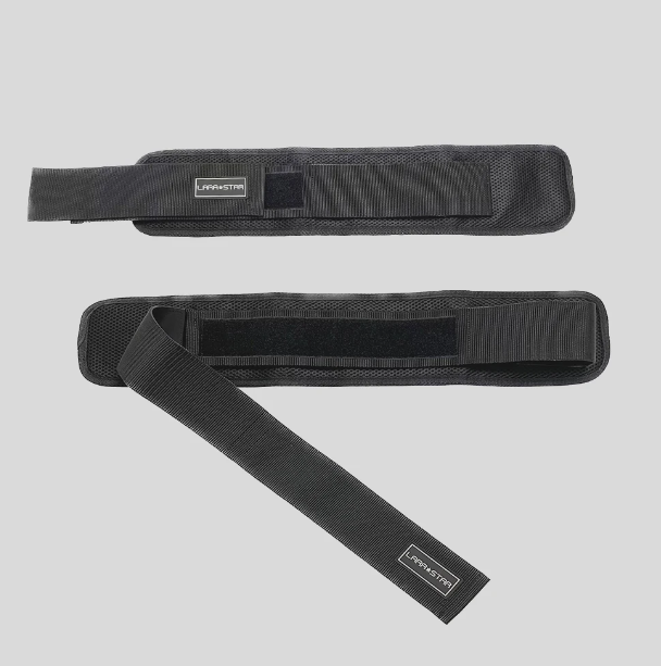 Black hip thrust belt with built-in padded cushion holding dumbbells for home glute bridge workout — view 3