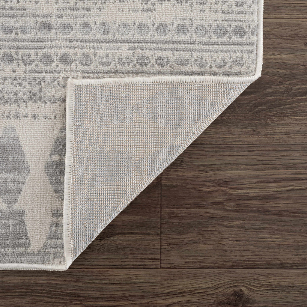 Hauteloom Chinnor area rug in light gray, charcoal, and off-white with transitional bohemian patterns — view 5