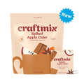 Craftmix Spiked Apple Cider cocktail mix packets arranged for cozy autumn and holiday entertaining