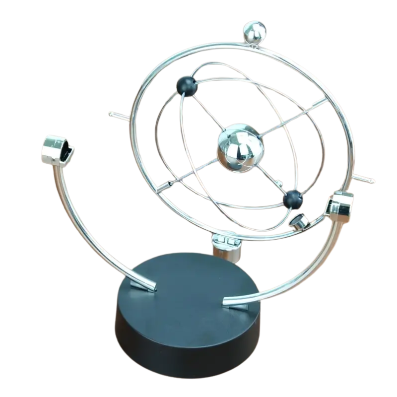 Mixed color tabletop Newton's cradle pendulum desk decor piece showing perpetual motion kinetic art