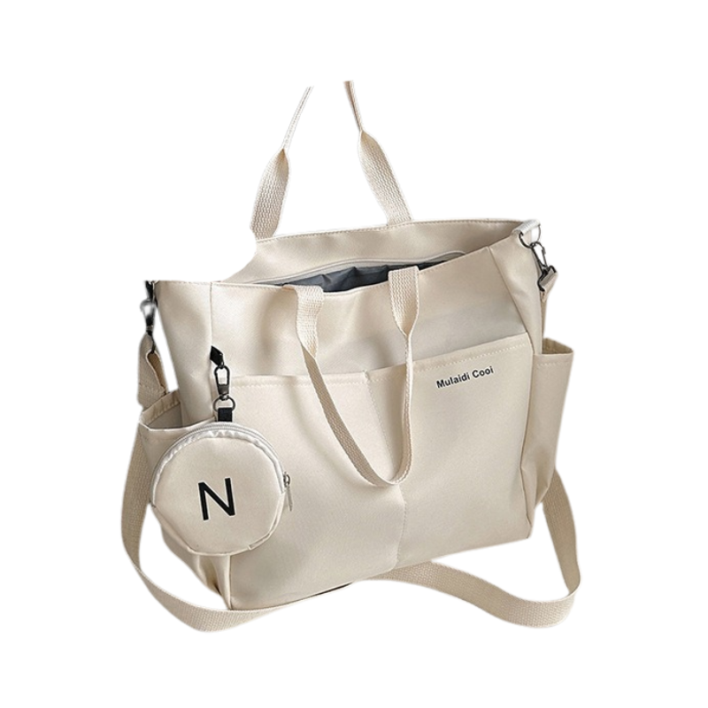 Beige waterproof Oxford tote bag with crossbody strap and exterior flap pocket