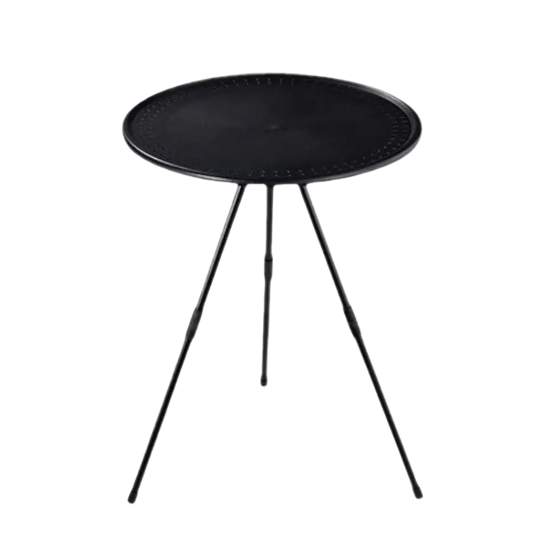 Portable round camping table with tripod base and fabric storage bag for outdoor adventures.