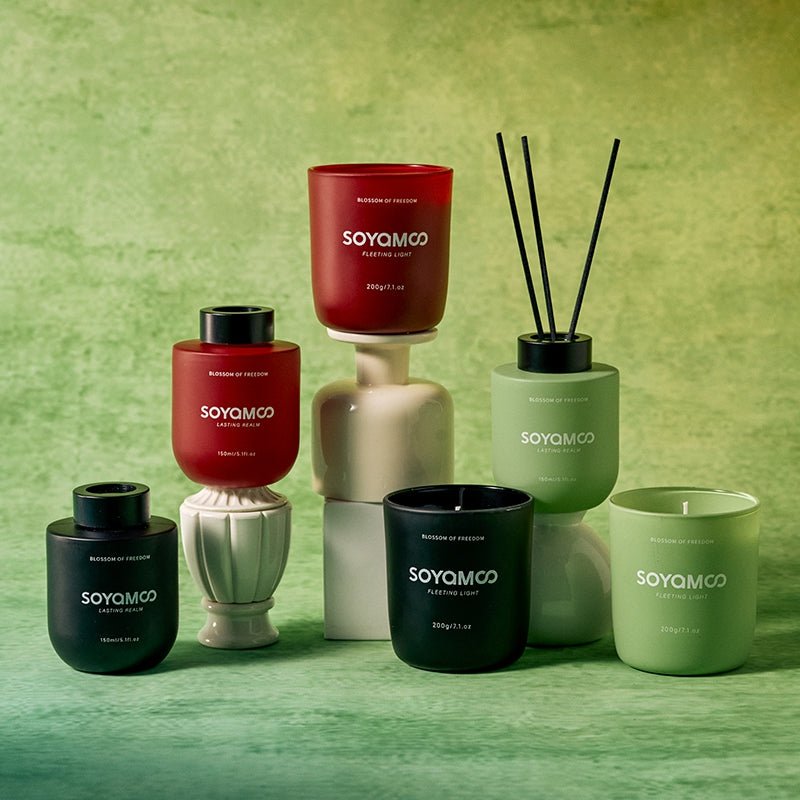Sandalwood candle and reed diffuser set in sophisticated matte black vessels — view 2