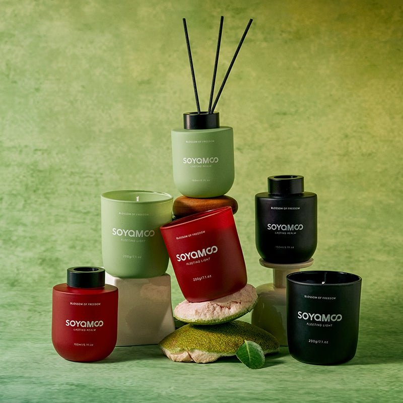 Sandalwood candle and reed diffuser set in sophisticated matte black vessels — view 3