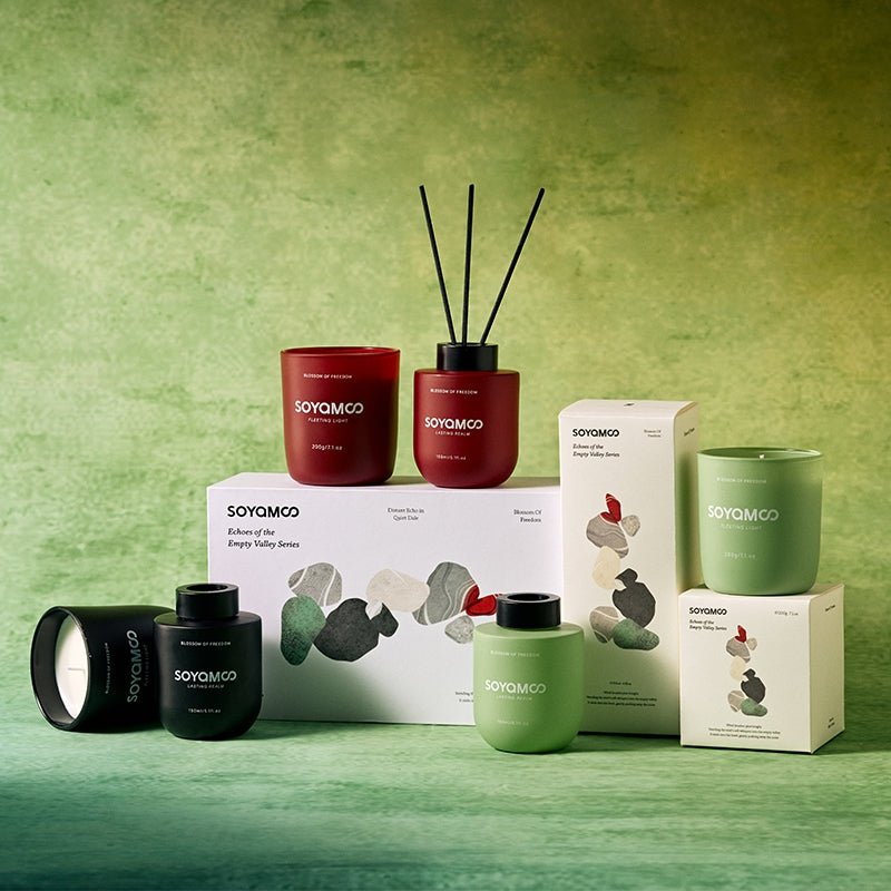 Sandalwood candle and reed diffuser set in sophisticated matte black vessels — view 4