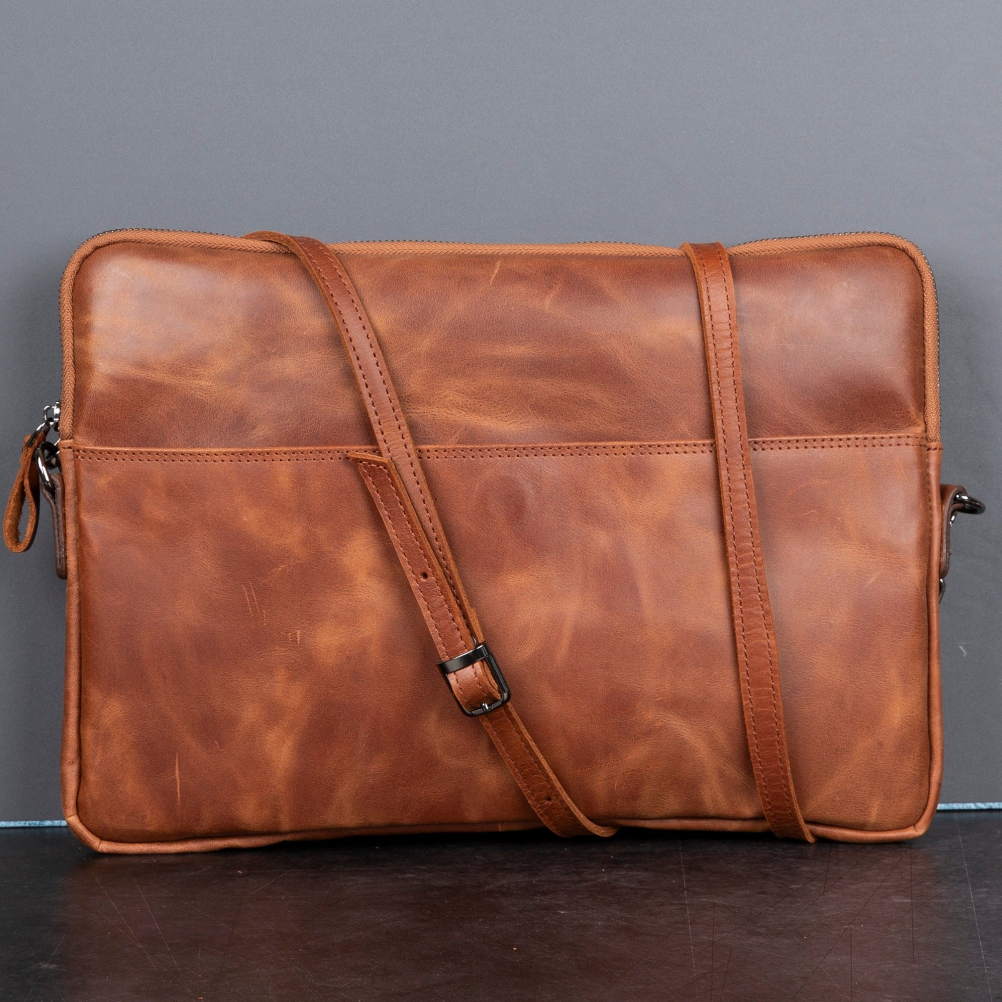 Genuine leather laptop bag with shoulder strap, soft suede interior, and front pocket for professional use. — view 2