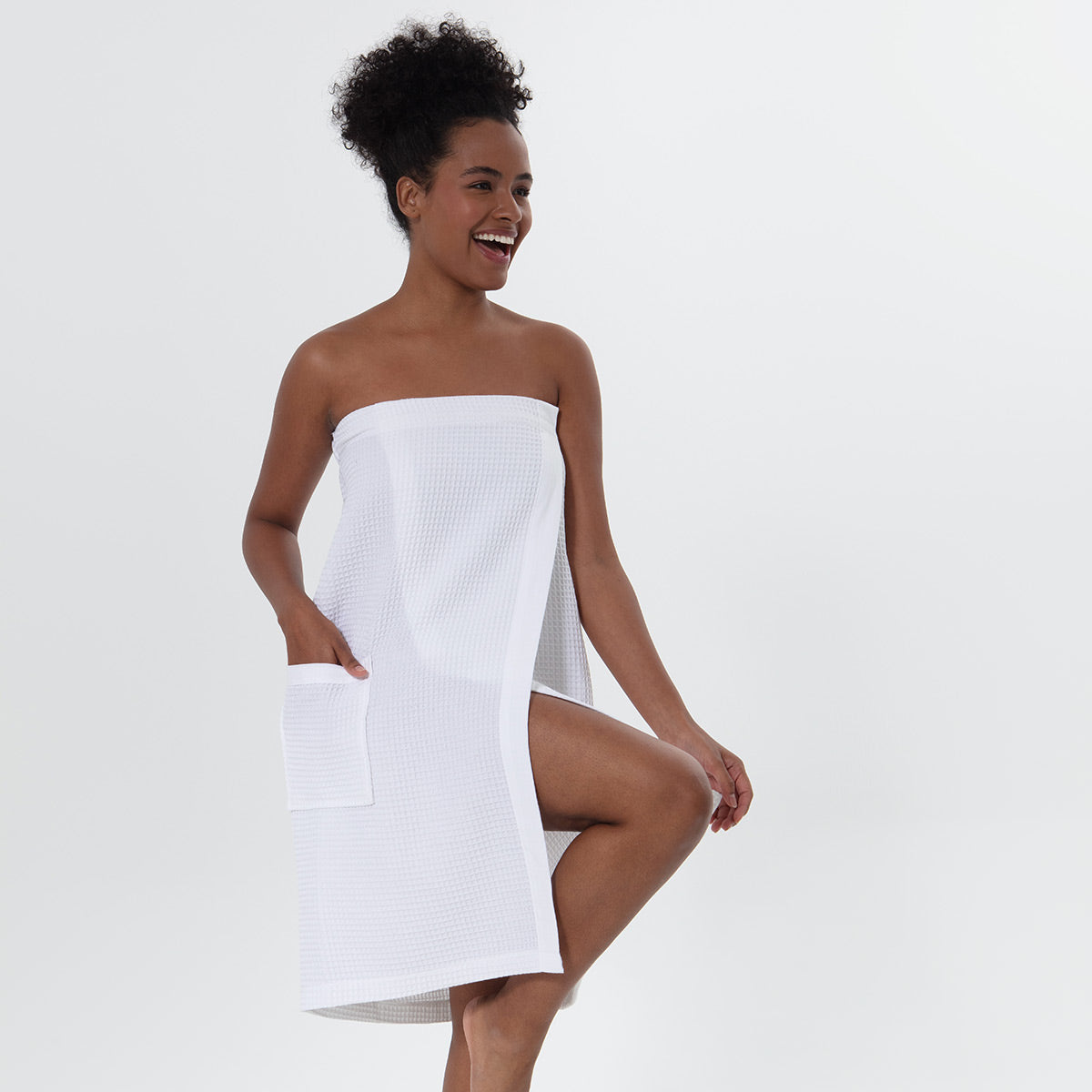Women's organic Turkish cotton waffle towel wrap with adjustable closure and front pocket