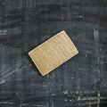 Eco sponge made of natural white wood pulp and textured yellow-brown loofah for kitchen dishwashing