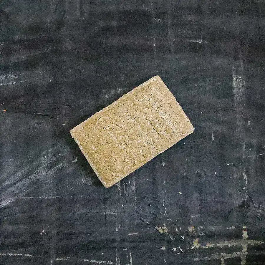 Eco sponge made of natural white wood pulp and textured yellow-brown loofah for kitchen dishwashing