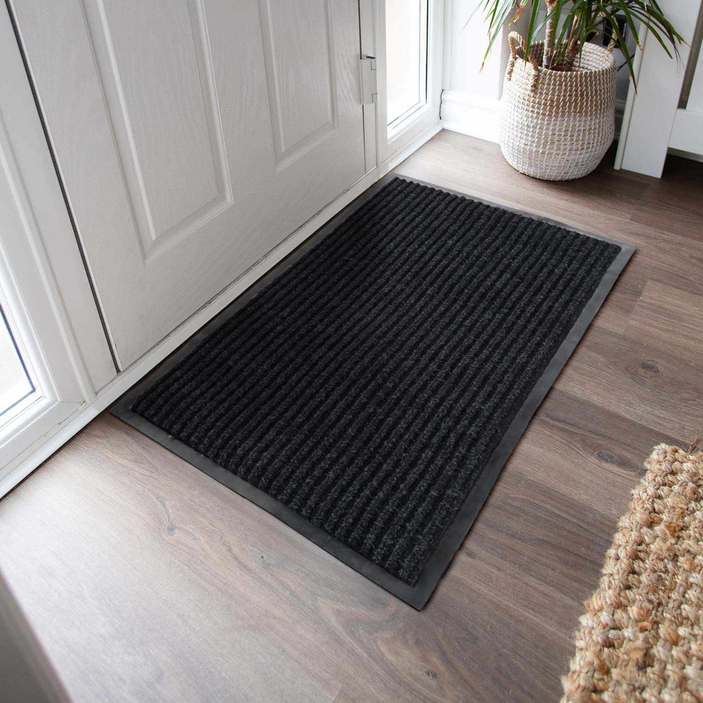 Basic black outdoor doormat, low profile polyester mat with rubber backing for porches and entryways — view 3