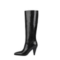 Sleek black croc-embossed knee-high boots with a pointed toe and structural cone heel