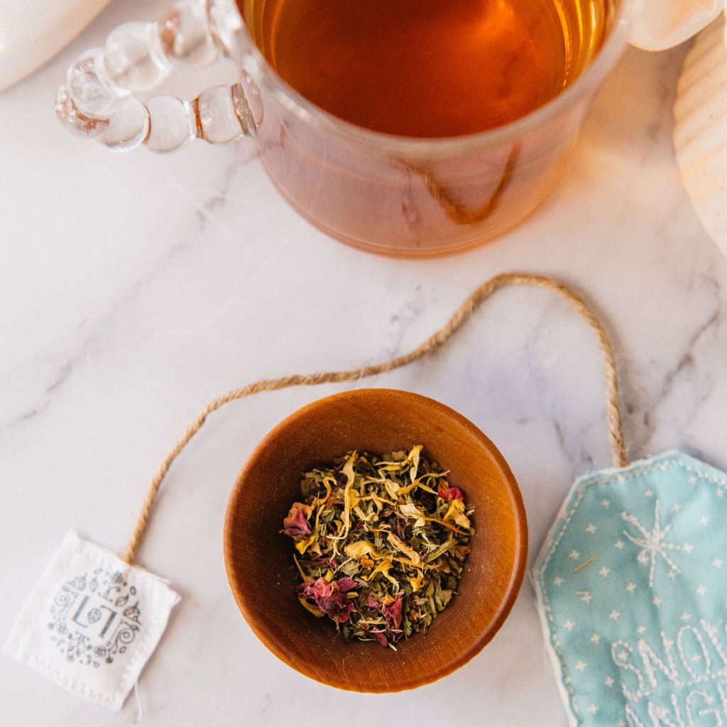Snow Angel herbal tea blend in a reusable keepsake paper canister with compostable mesh bags — view 3