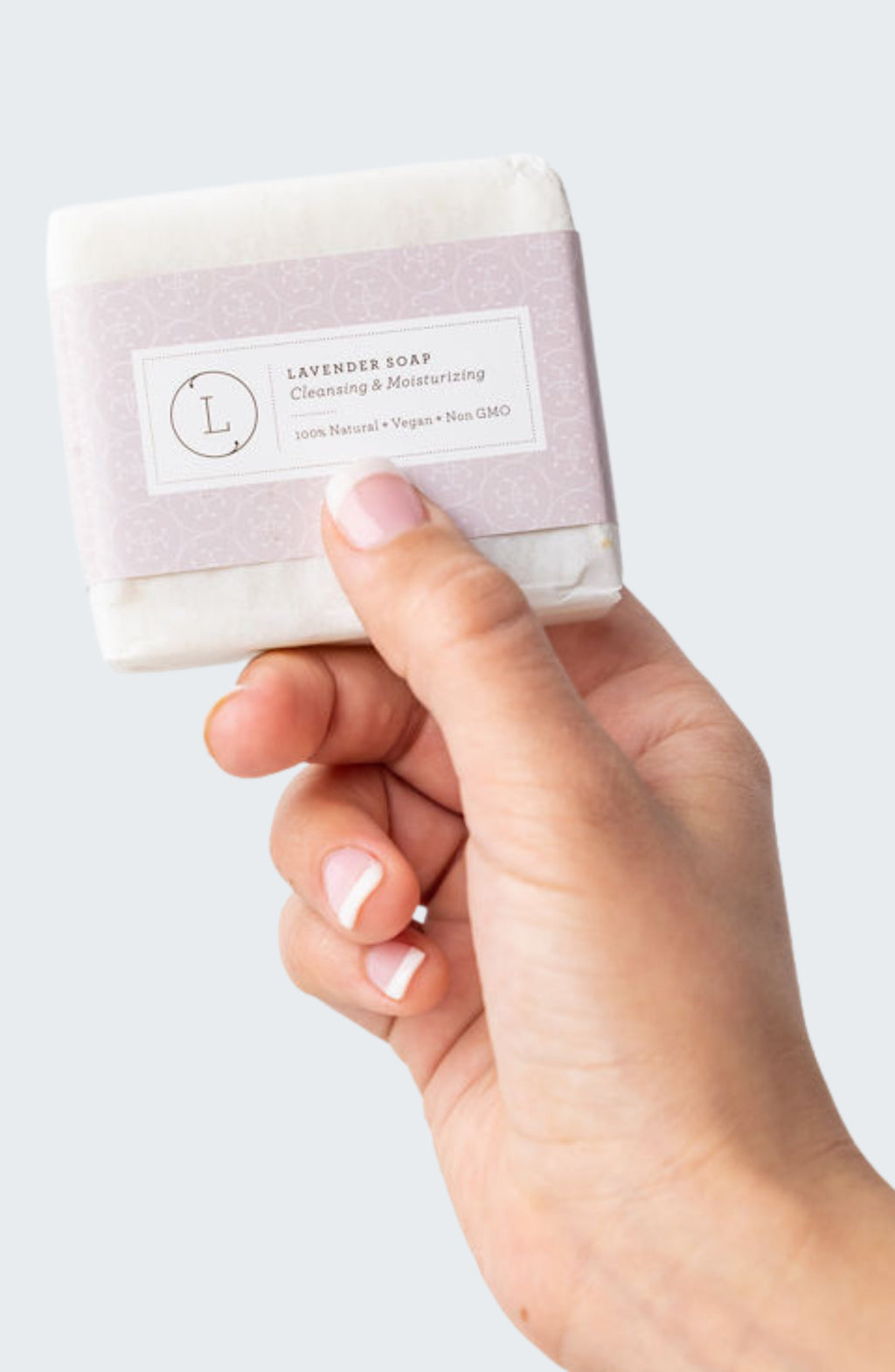 Two natural handmade lavender soap bars with real buds packed in a reusable cotton bag. — view 2