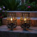 Set of two outdoor solar lanterns with gray rope base and rustic jute hanging handle