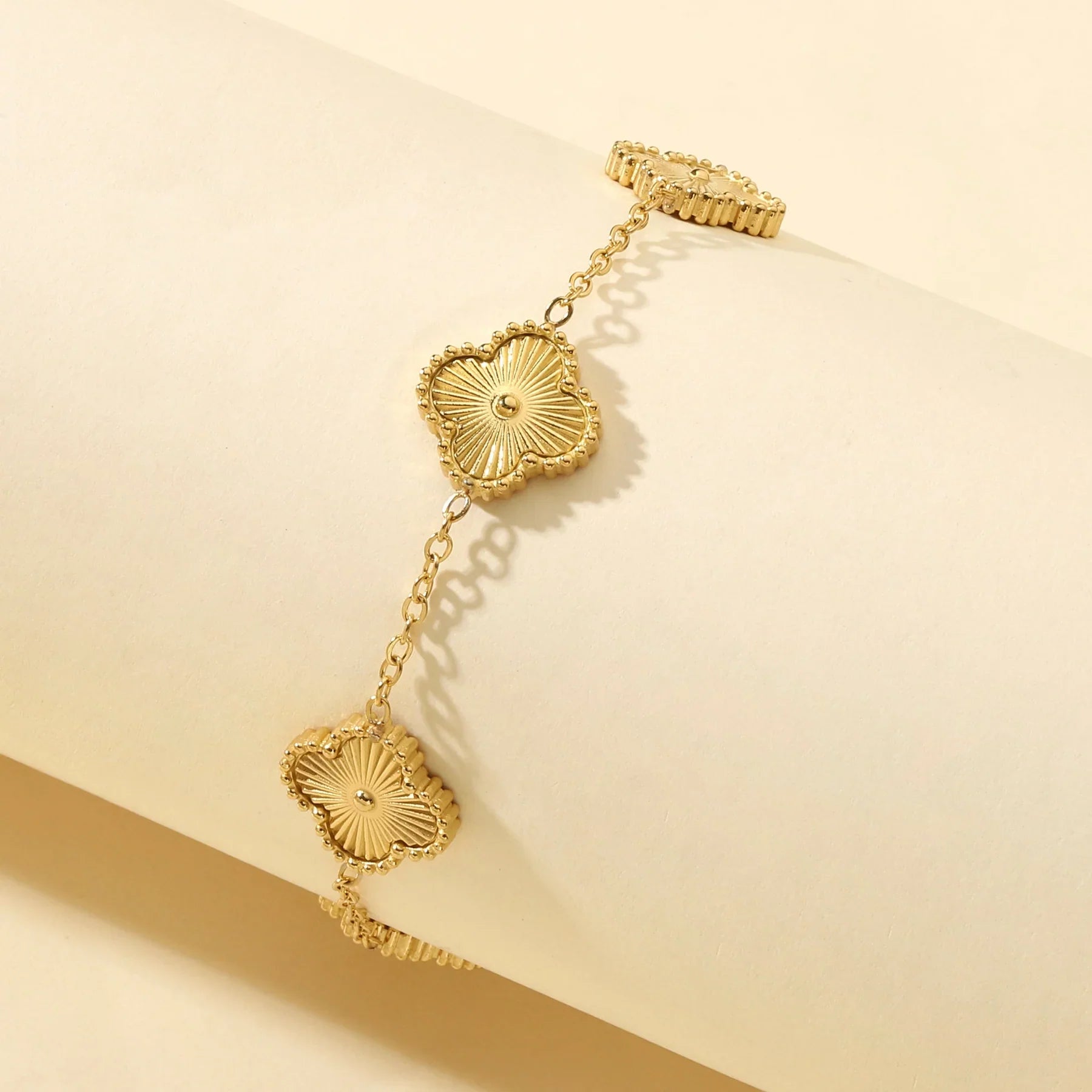 Golden clover flower charm bracelet with a radiant gold finish and delicate adjustable chain — view 3