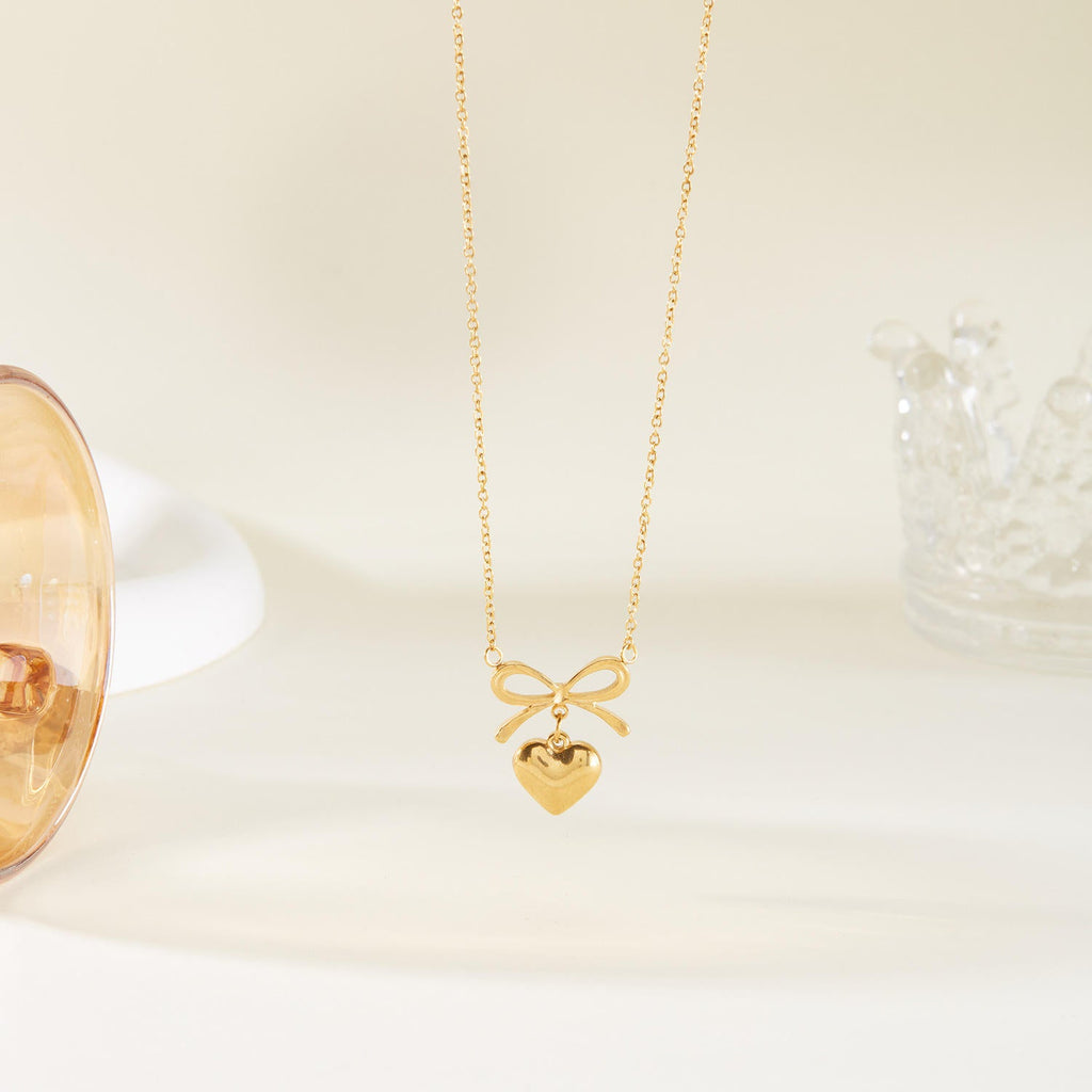 Dainty bow heart pendant necklace with polished finish and adjustable chain for women — view 5