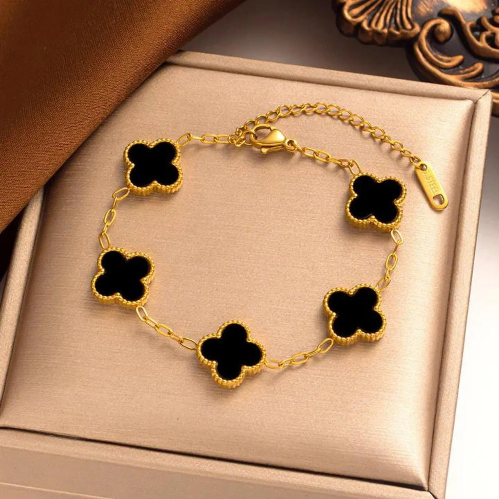 Elegant black four leaf clover charm bracelet featuring a minimalist adjustable band for women — view 4